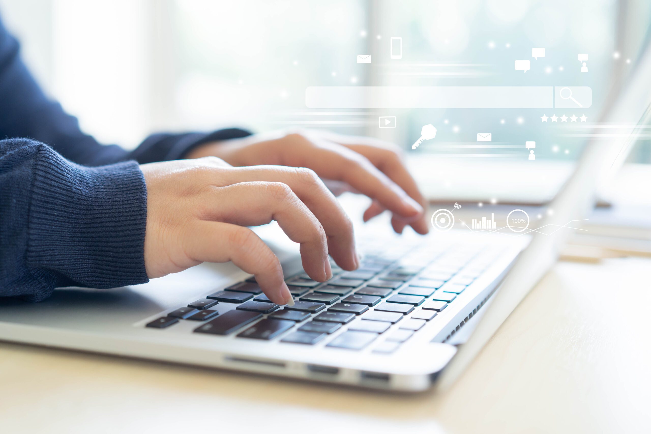 Close-up of hands typing on a laptop keyboard with floating digital security icons, representing SSL certificate protection and secure website access.